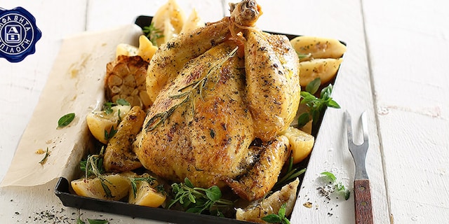 Κοτόπουλο στο φούρνο με μυρωδικά και λεμόνια κονφί